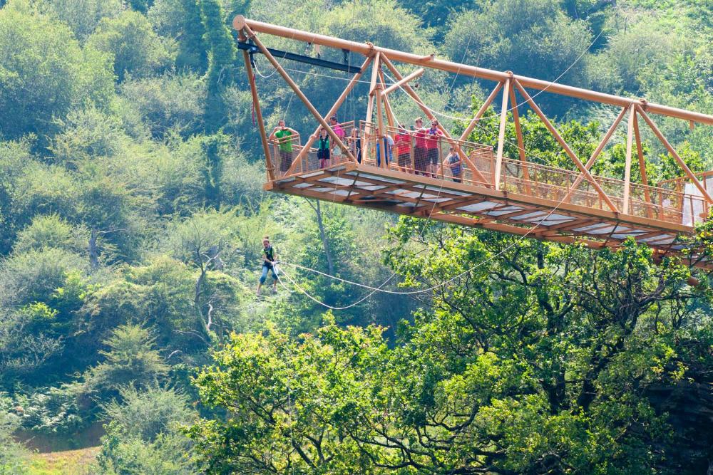 Group waiting to jump on a zip line in an adventure park